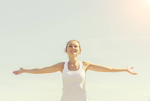 istock Young smiling female with arms wide open 180317180