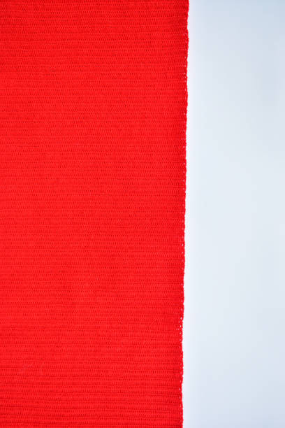 istock red wool knitted yarn texture, woolen fabric on white background 1803174272