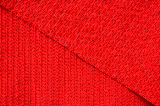 texture of red wool knitted yarn, woolen fabric background