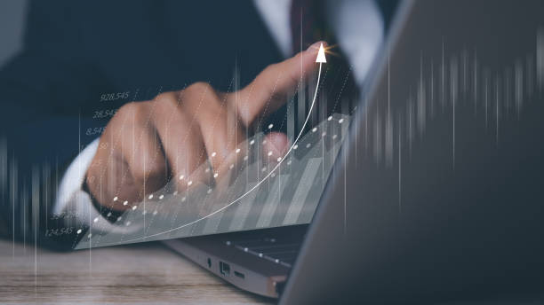 istock Businessman using laptop with forex trading graph financial data. Goal business success strategy chart target and planning. Stock market, financial graph growth report, business development. 1803199433