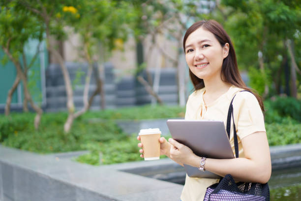 istock Asian woman student portrait on campus. 1803210173