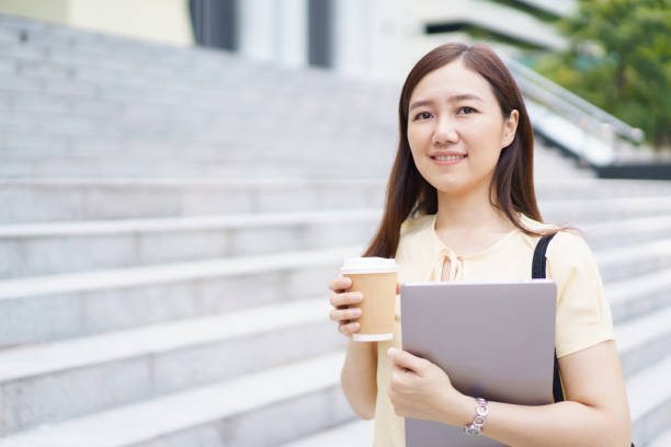 istock Asian woman student portrait on campus. 1803210181