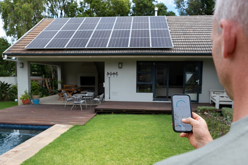 Man uses mobile app to control his solar power system.
