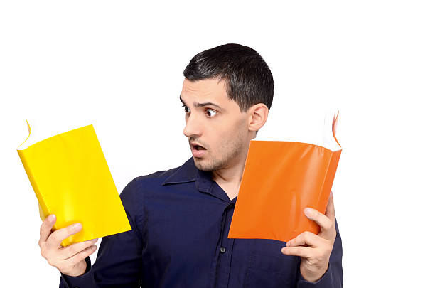 istock Young man looking amazed at the books. 180326285