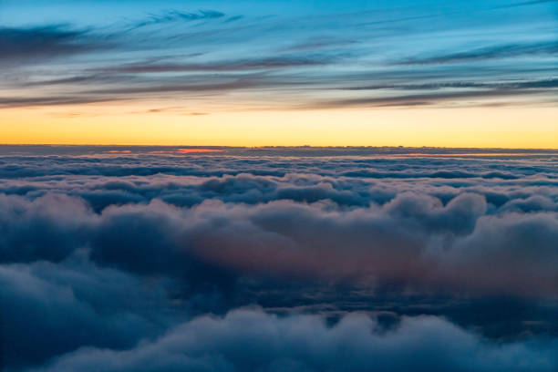 istock Flying above the clouds at dusk 1803279265