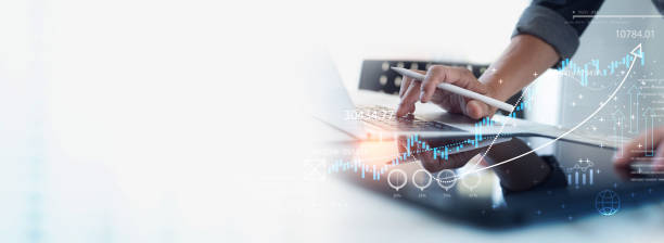 istock Businessman, accountant working on laptop computer, calculating and analyzing financial report, business data and planning with economic graph growth chart, business finance and investment concept 1803282482