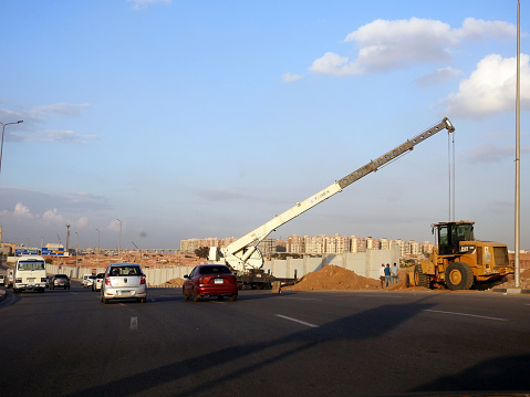 Cairo, Egypt, November 14 2023: A mobile crane at a construction site, a tough and ready workhorse, for lifting and material processing products and services, Terex crane mobile vehicle for lifting, selective focus
