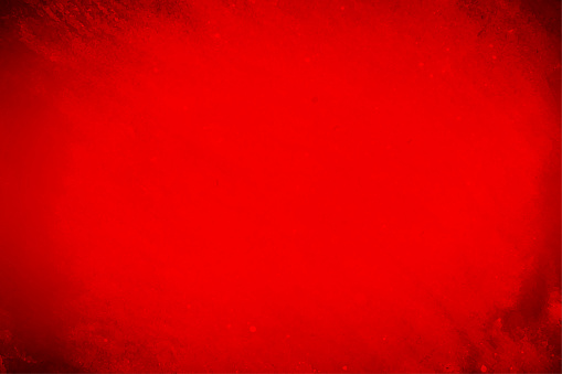 Horizontal vector illustration of rough textured dark red maroon gradient colour gradient vector abrasive surface blistered backgrounds. There is no text, people and ample copy space over dark backdrop.