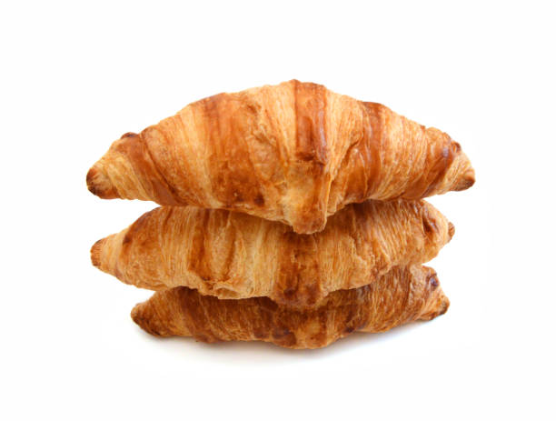istock Fresh and tasty croissant over white background 1803307369