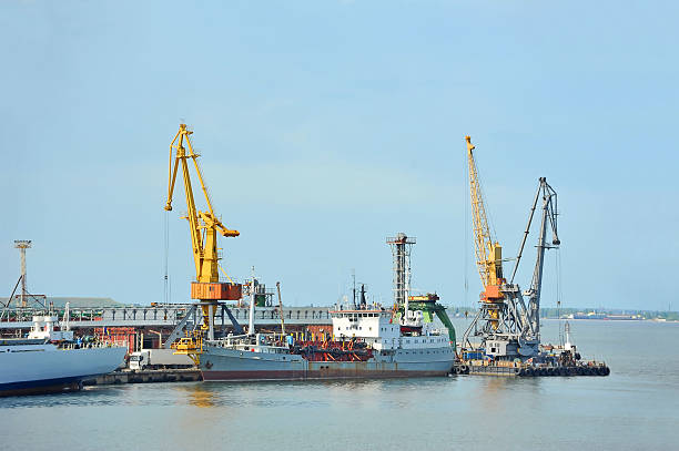 istock Pump-dredge ship under port crane 180331265