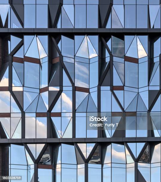 Unique Reflective Glass Building Angular Distinctive Diamond Shaped Window Stock Photo - Download Image Now