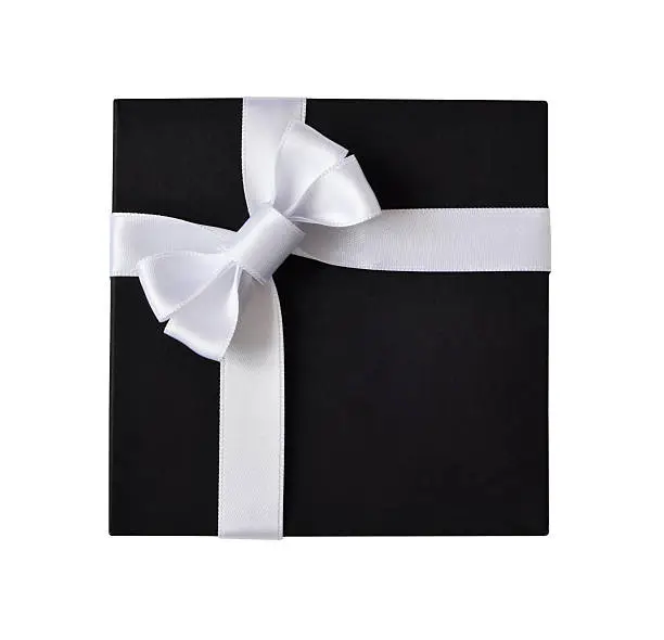 Black gift box with white ribbon isolated on white background, top view