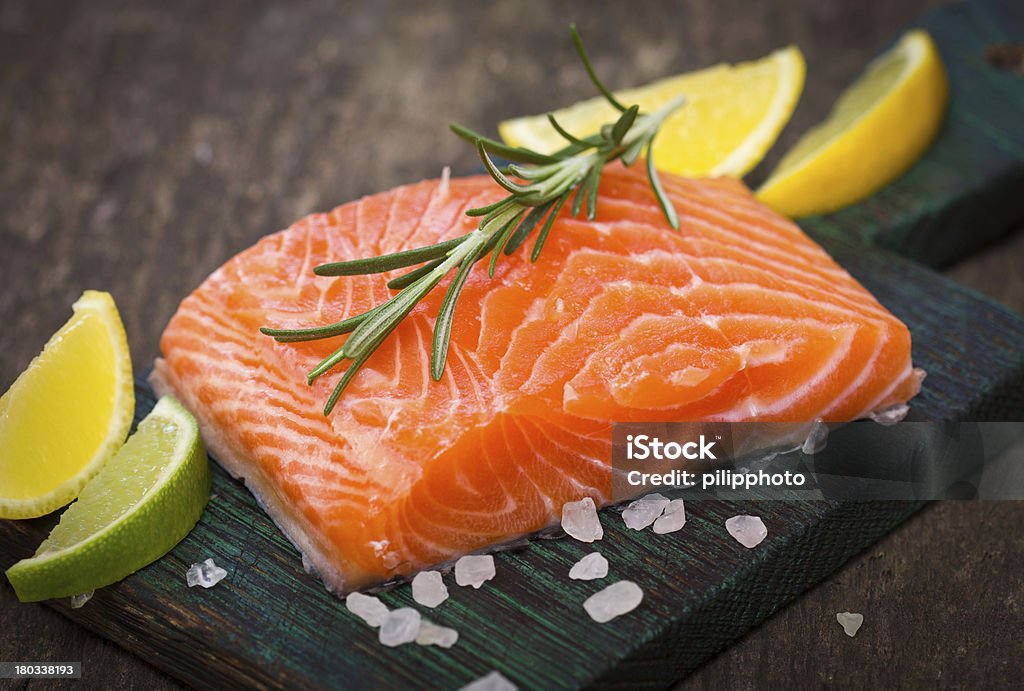 Fresh salmon Fresh salmon on the wooden table Backgrounds Stock Photo