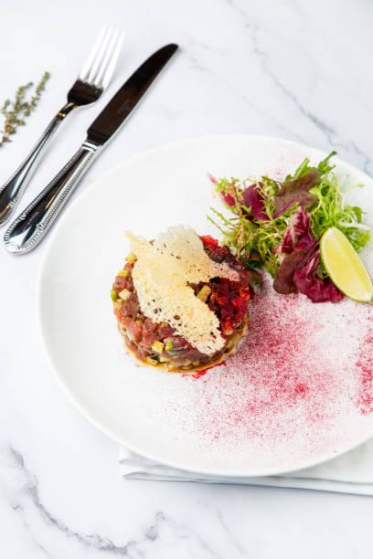 istock meat salad with arugula and lime, top view 1803399096