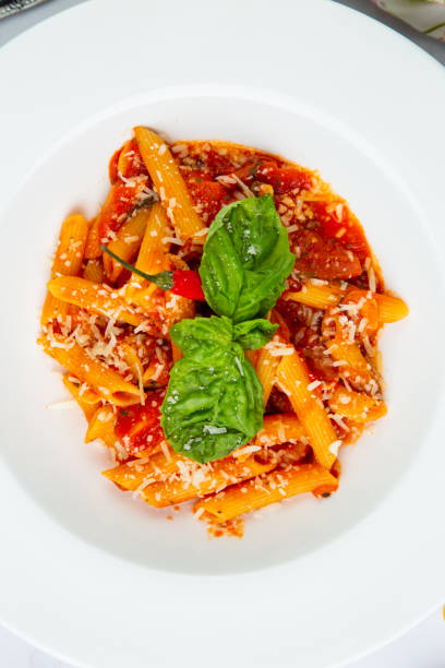 istock pasta in tomato sauce with cheese and herbs top view 1803402734