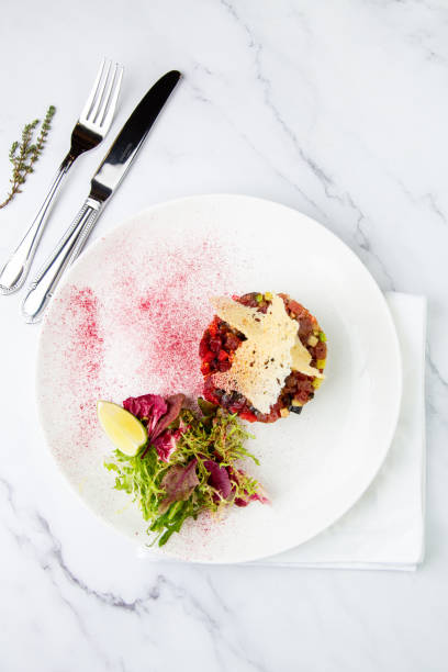 istock meat salad with arugula and lime, top view 1803407452