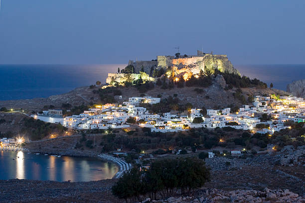 istock Lindos with it's ancient Acropolis at dawn. Rhodes, Greece 180342082