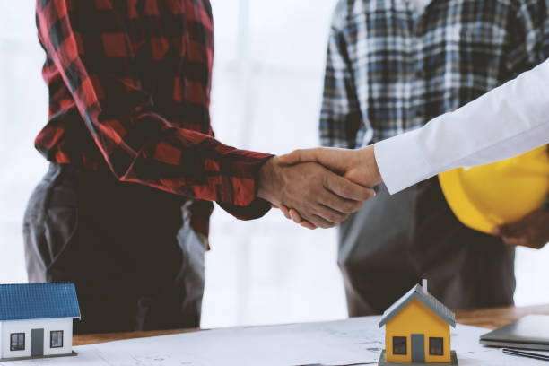 istock Engineer and architect handshake agree to work together to achieve success together. 1803453175