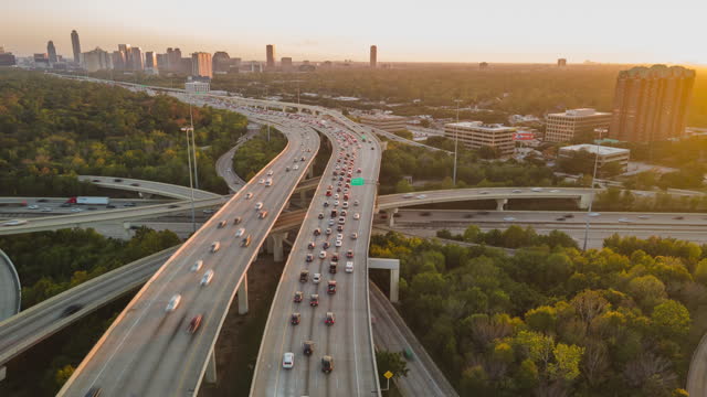Aerial Drone Hyperlapse Fly Above Big Urban Highway Intersection in Houston USA Interstate i10 and i610 Freeway during Daylight. Rush Hour I45 and I610 intersection.