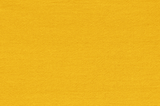 Yellow gold cotton fabric cloth texture for background, natural textile pattern.