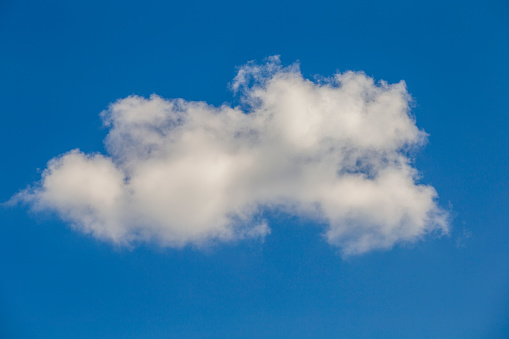 White clouds on a blue sky background. Nature concept