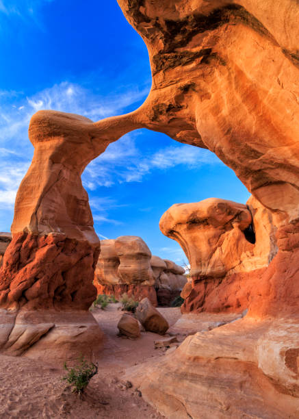 Metate Arch Golden Hour Golden light on Metate Arch in the Devil's Garden area of Grand Staircase-Escalante National Monument near Escalante, Utah. grand staircase escalante national monument stock pictures, royalty-free photos & images