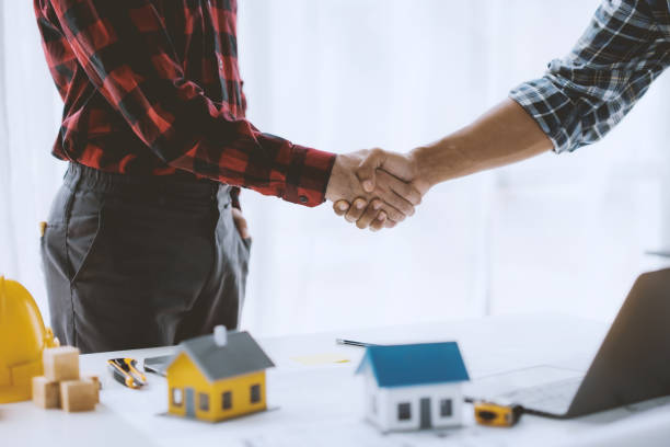 istock Engineer and architect handshake agree to work together to achieve success together. 1803474446