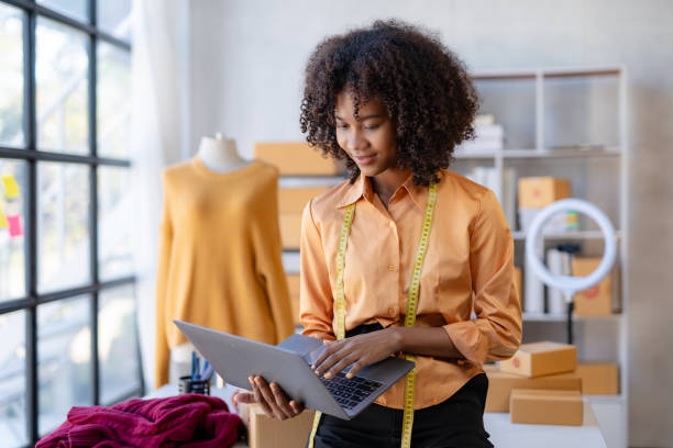 istock Young African American female clothing designer working inside office. 1803474987