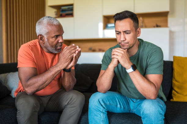 istock Handsome Mature Friends Discussing Mental Wellness 1803478690