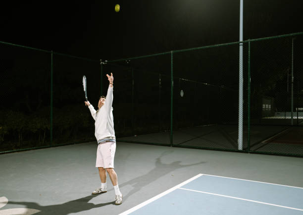 istock Playing Tennis outdoors at night 1803488917