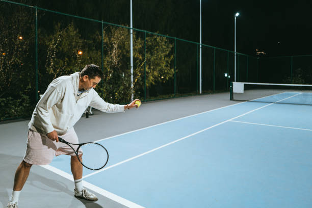 istock Playing Tennis outdoors at night 1803489454