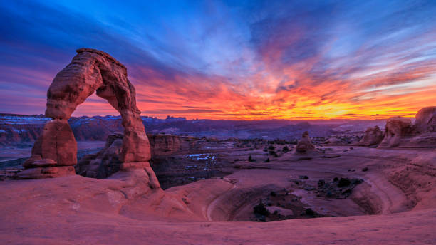 istock Delicate Arch and Sandstone Bowl at Sunset 1803490536