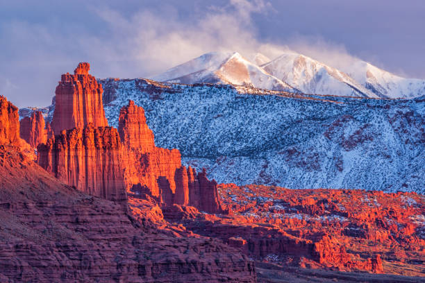 istock Fisher Towers and La Sals Blowing Snow 1803492132