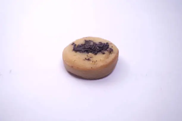 Photo of Kue Cubit is a popular snack in Jakarta, Indonesian version of Dutch poffertjes. Topped with chocolate sprinkles, served on a white plate and isolated on a white background.