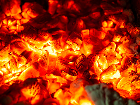 Barbecue Grill Pit With Glowing And Flaming Hot Charcoal Briquettes