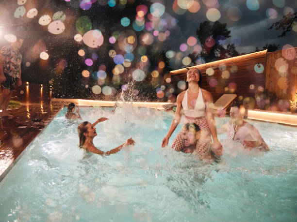 istock Fun in the pool at night! 1803519474