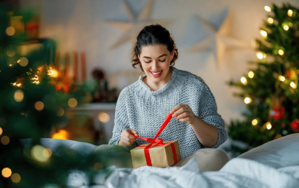 istock woman with Christmas present 1803526057