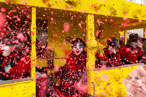 Basel, Switzerland - March 1st 2023. Waggis on a float throwing confetti