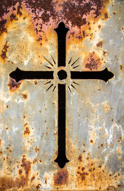 istock Crucifix on a rusty metal door 1803543792
