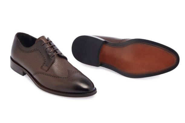istock Brown Leather Shoes On White Background 1803549624