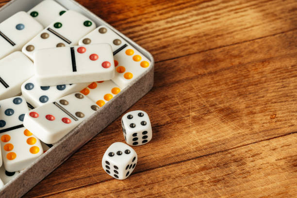 istock Domino game on brown wooden background close up 1803556542