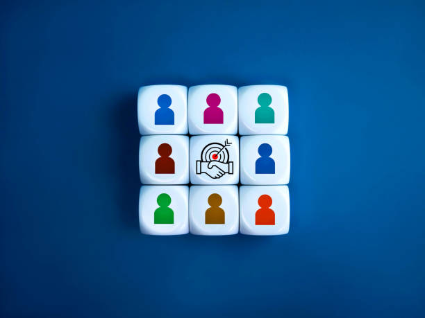 istock Stakeholder, business connection, teamwork, partnership and team building concept. Target with handshake deal icon surrounded with multicolor businessman symbol on white cube blocks stacked as one. 1803573913