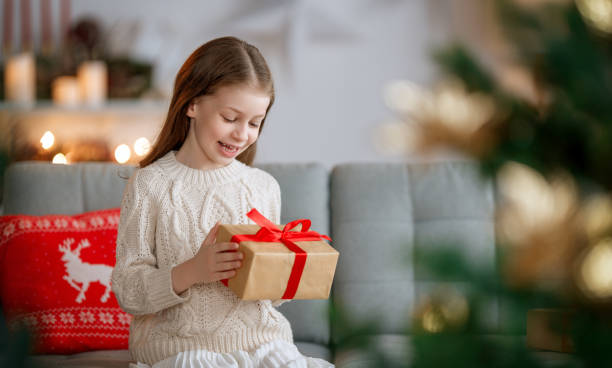 istock girl with Christmas gift 1803585897