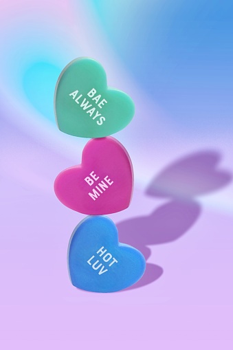 Love Always, Be Mine, Hot Luv - Candy Heart Messages for Romantic Gifts and Cards in a Close-Up View
