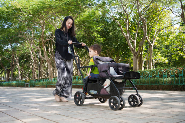 istock A woman with a stroller to play with children 1803612298