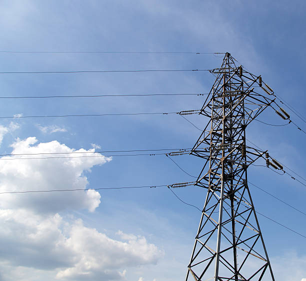 istock Electricity pylons and line against the blue sky 180361454