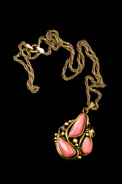 istock Gold necklace on black 1803615483