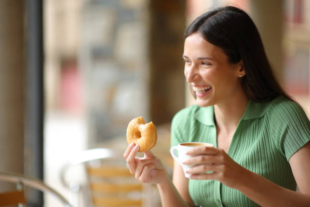 istock Happy woman laughing at breakfast in a bar 1803621962