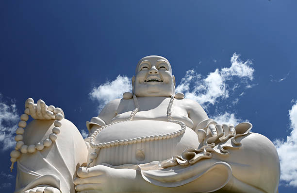 istock Laughing Buddha Against the blue sky 180362435