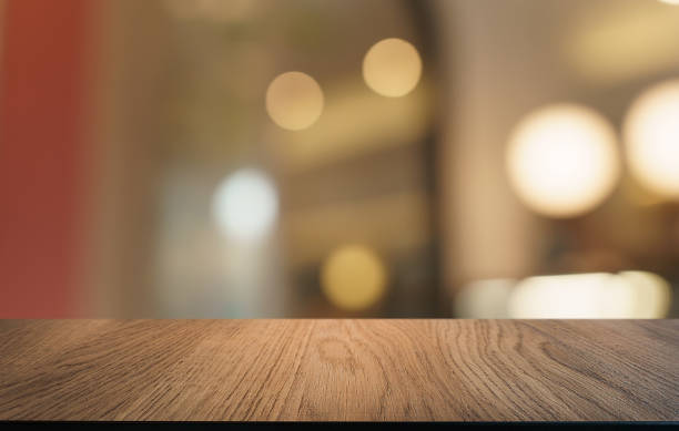 istock Mock up for space. Empty dark wooden table in front of abstract blurred bokeh background of restaurant . can be used for display or montage your product 1803627569